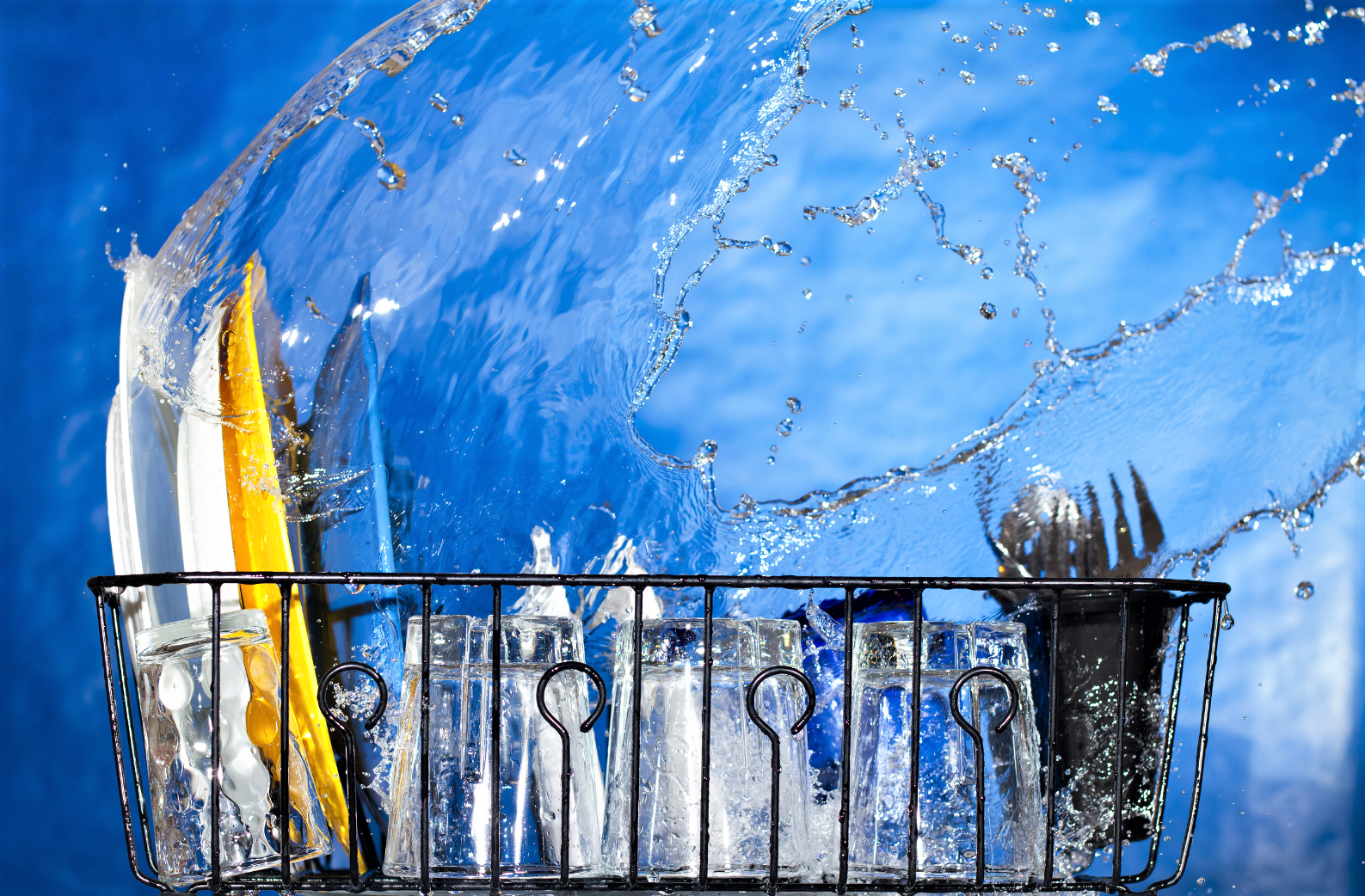 Water splash on stacked dishes