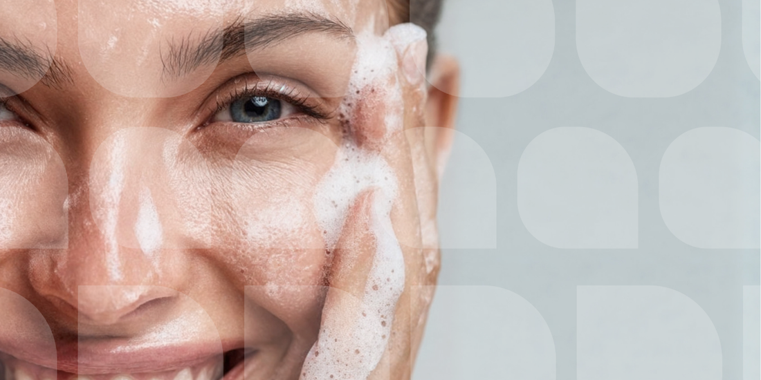 Close up image of woman washing her face with soap suds