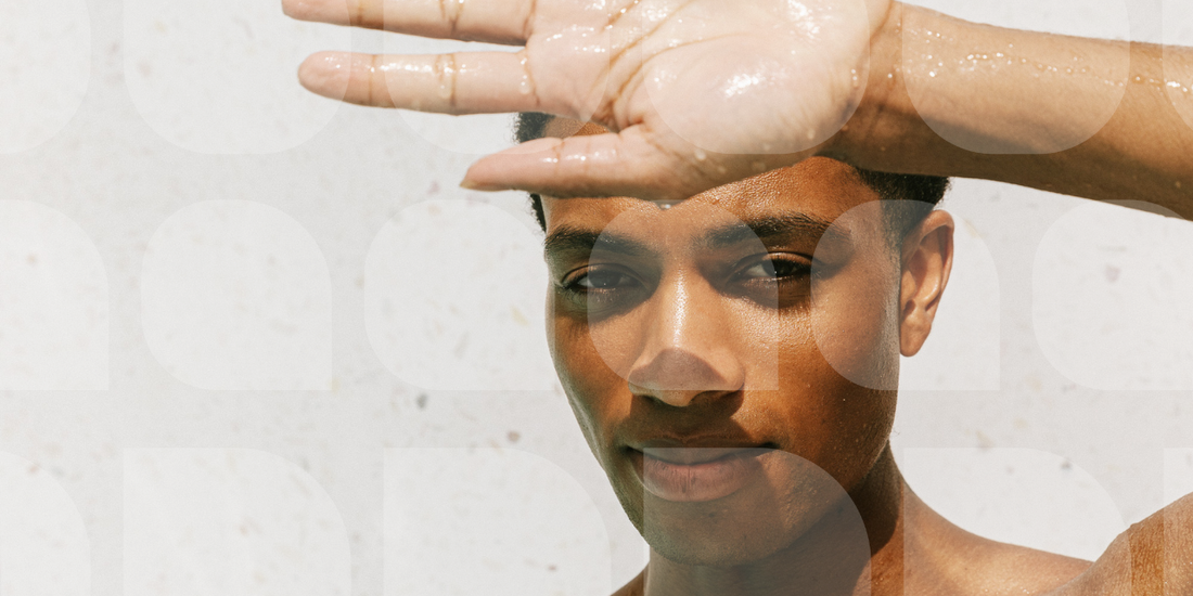 man in shower looking at the camera