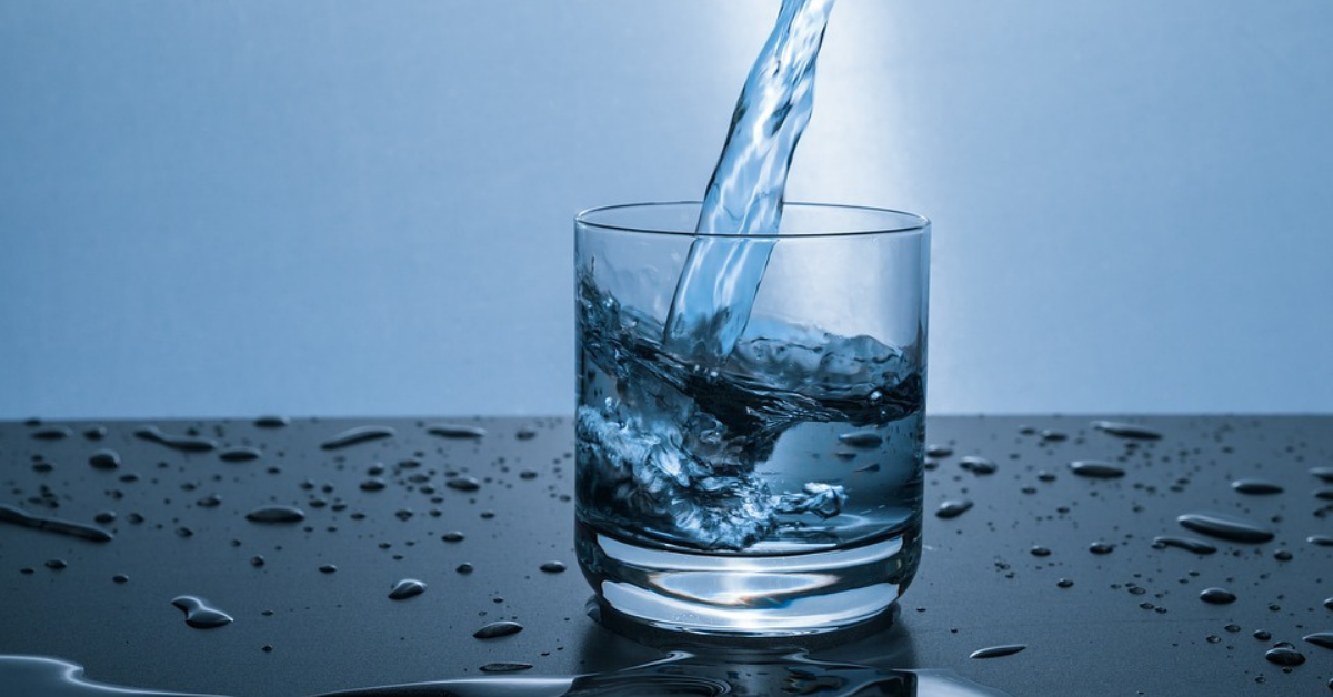Pouring pure water into glass