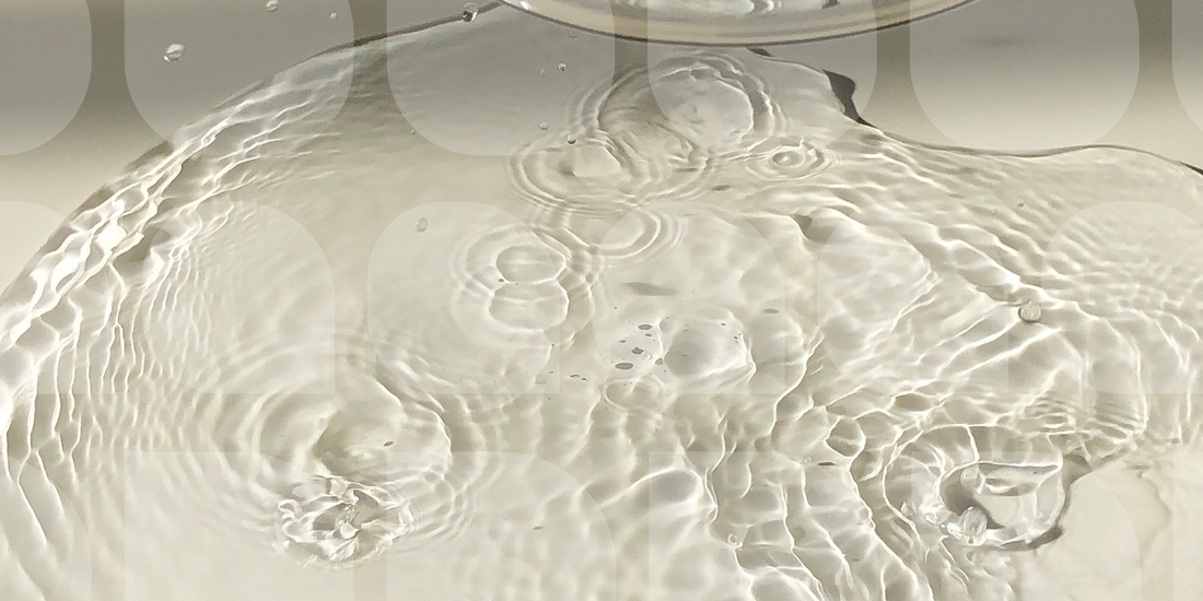 pool of water with droplet ripples
