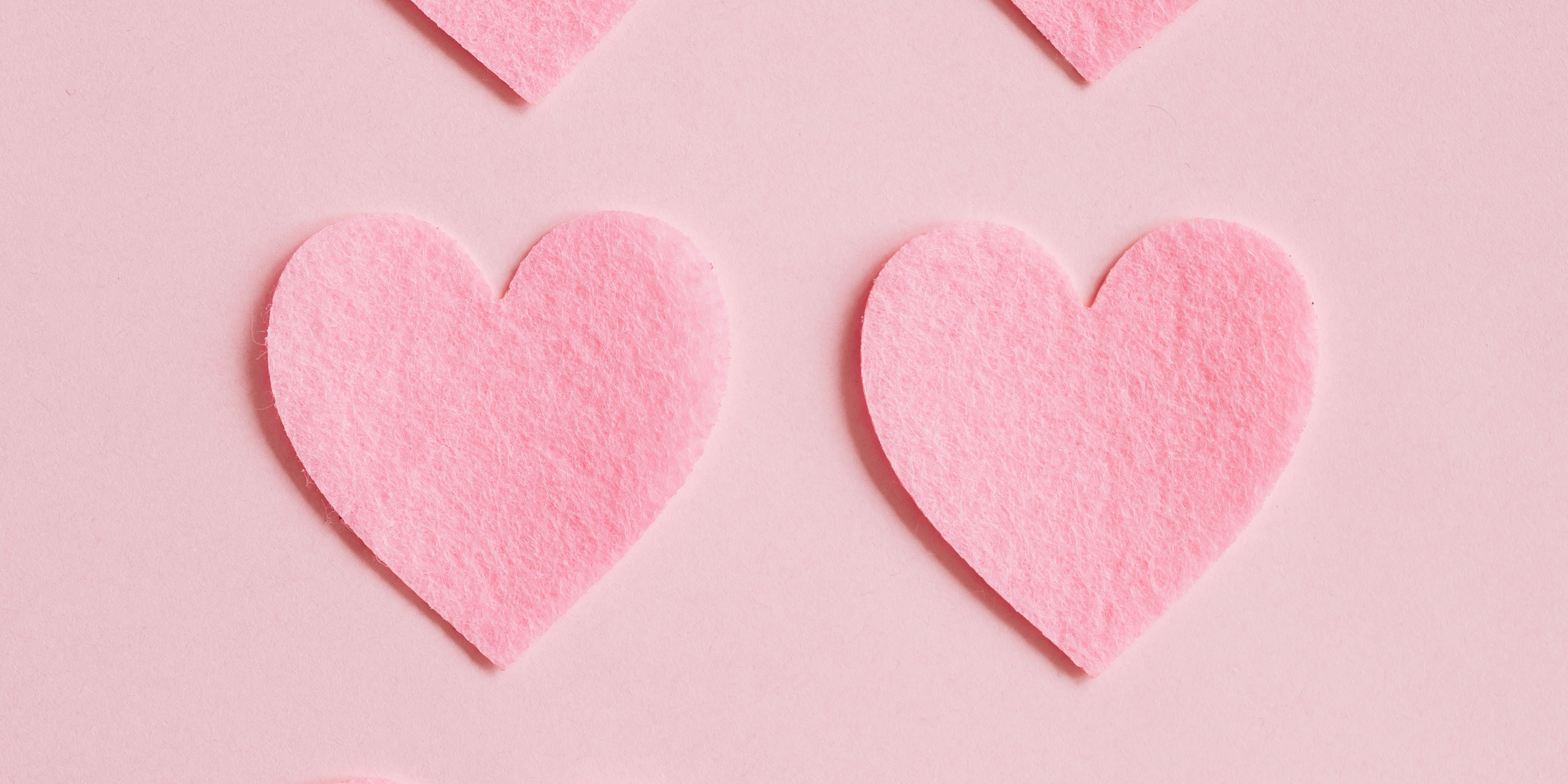Pink paper hearts on a pink backdrop 