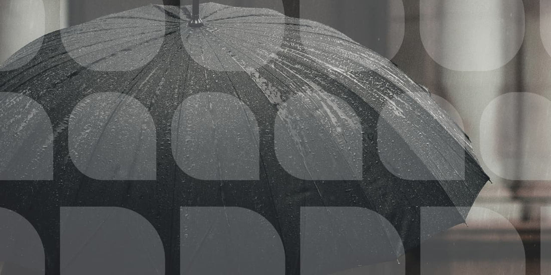 raindrops on opened black umbrella