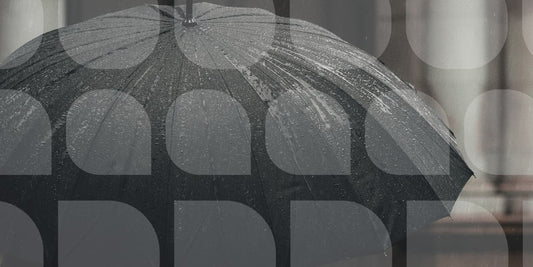 raindrops on opened black umbrella