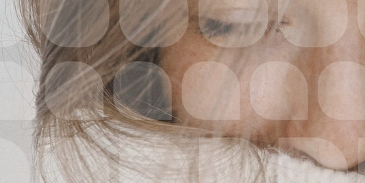 close up of skin in face tucked into a cozy winter sweater