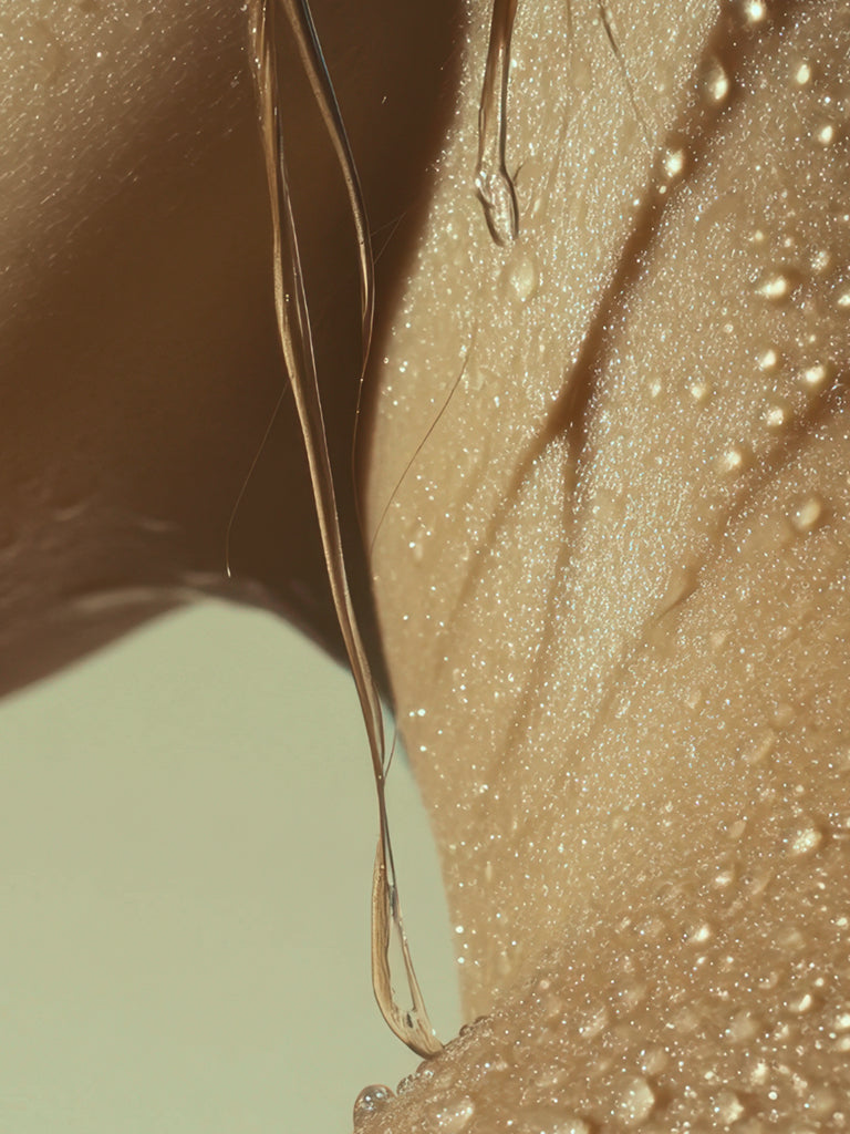 Close-up of someones neck with water droplets on a light green background