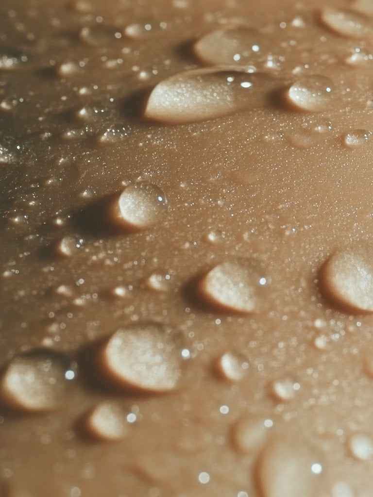 Close-up of water droplets on light skin