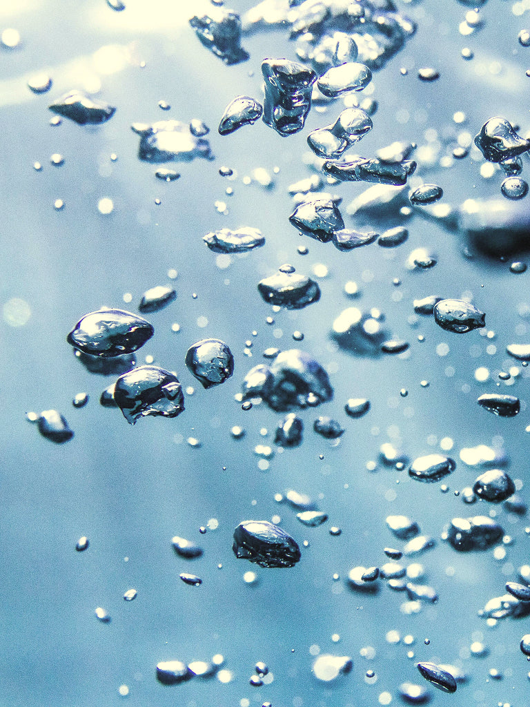 Close-up of water bubbles in pool of water