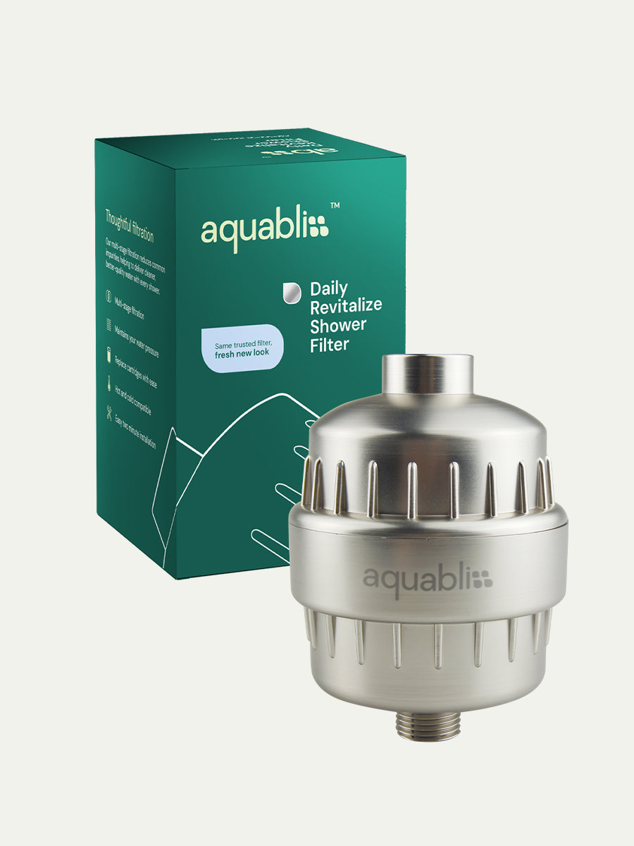 Aquabliss shower filter with packaging on a white background and product in the foreground