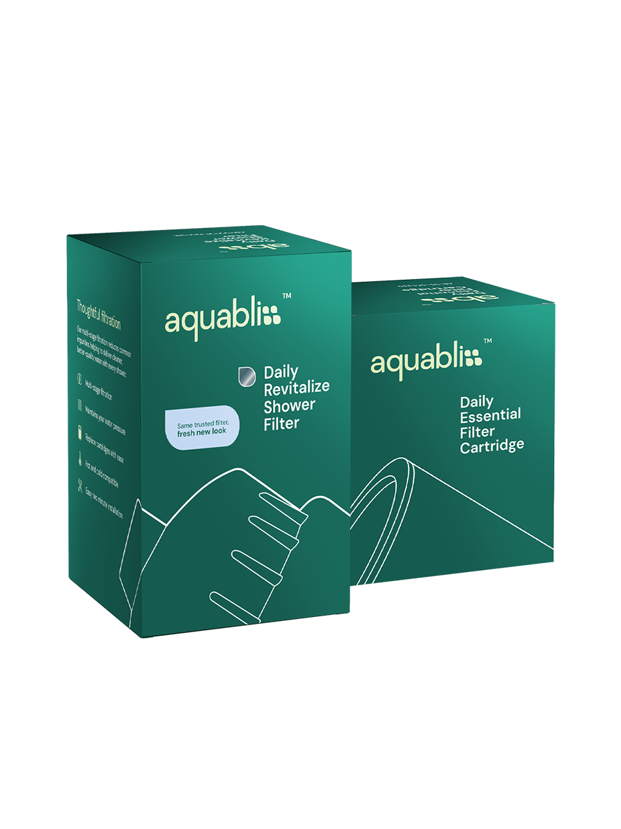 Two Aquabliss shower filter product boxes on a plain white background, one labeled Daily Revitalize Shower Filter and the other Daily Essential Filter Cartridge.