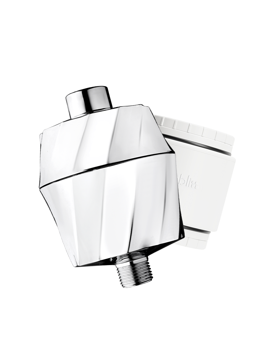 A modern chrome shower head with a faceted geometric design, shown alongside its white filter cartridge on a solid white background.