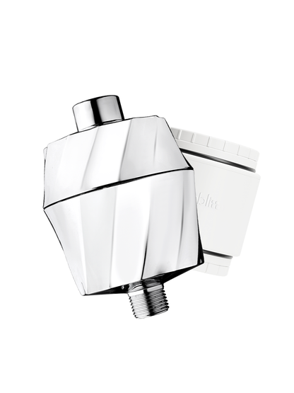 A modern chrome shower head with a faceted geometric design, shown alongside its white filter cartridge on a solid white background.
