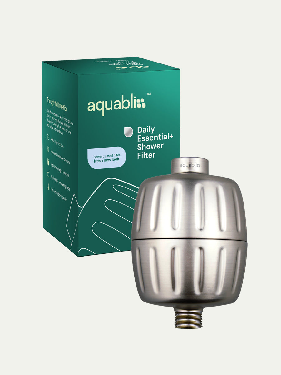 Aquabliss shower filter with packaging on a white background and product in the foreground
