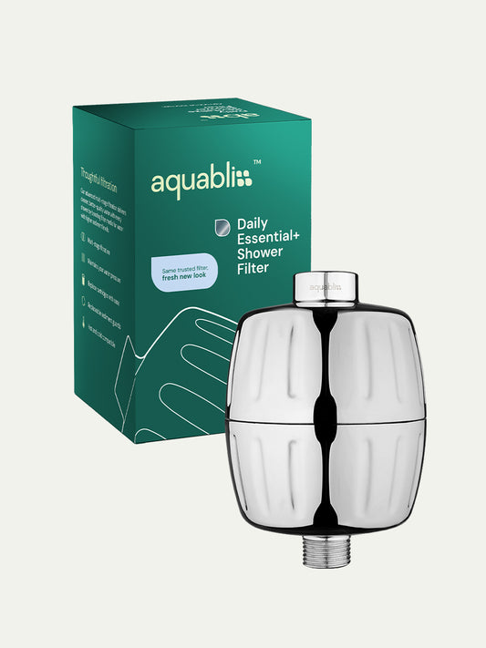 Aquabliss shower filter with packaging on a white background and product in the foreground 