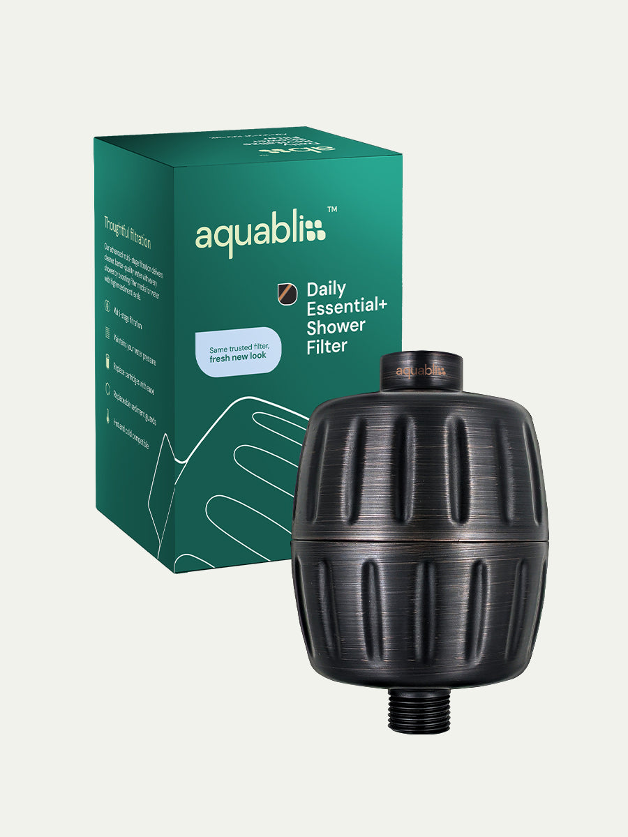 Aquabliss shower filter with packaging on a white background and product in the foreground