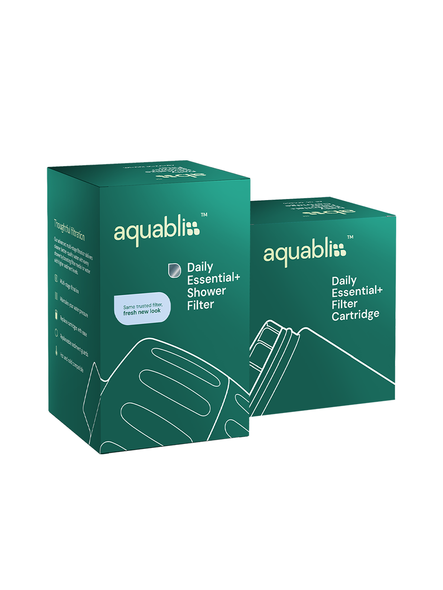Two teal-green Aquabliss Daily Essential+ Shower Filter boxes on a plain white background, with one box in front and one behind it.