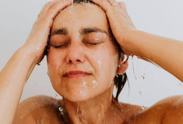 happy woman taking shower