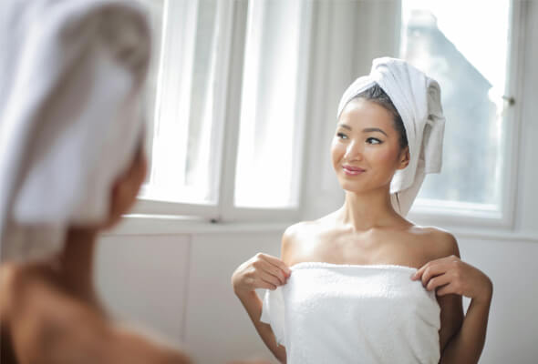 lady using showerhead for low water pressure