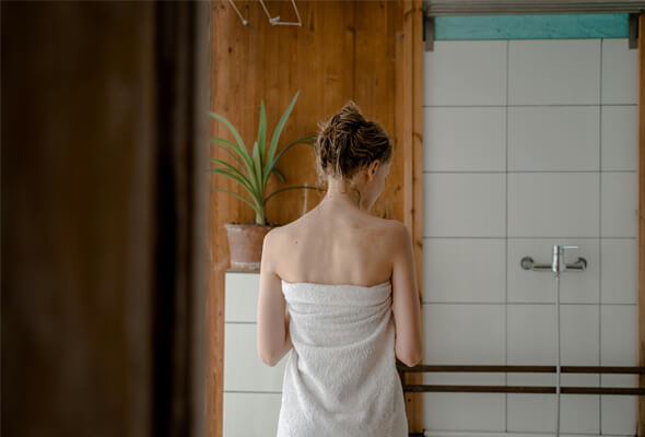 woman feel refreshed after shower with showerhead with high pressure
